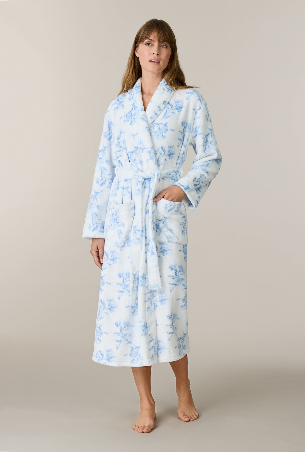 A lady wearing Winter Blue Floral Wrap Chenille Ballet Robe