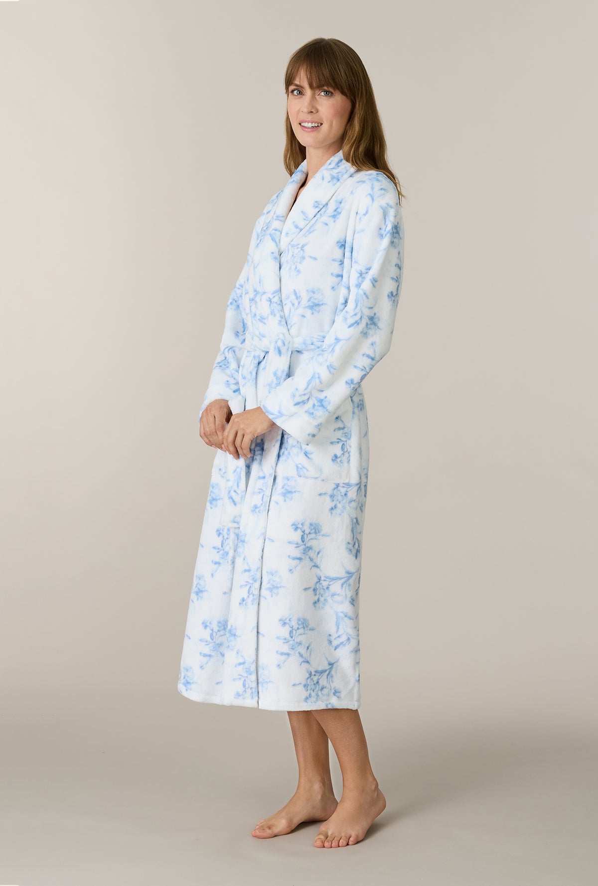 A lady wearing Winter Blue Floral Wrap Chenille Ballet Robe side view