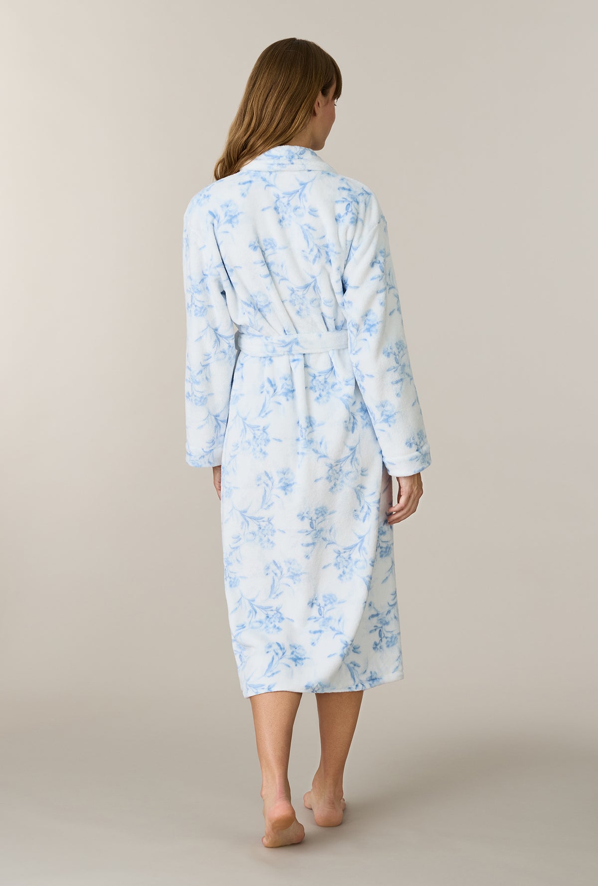 A lady wearing Winter Blue Floral Wrap Chenille Ballet Robe back view