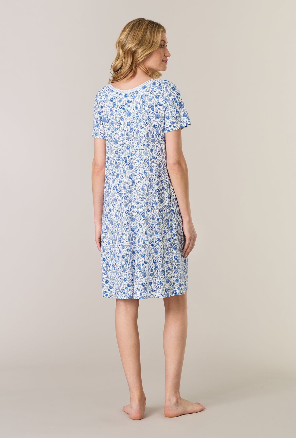 A lady wearing Twilight Paisley Short Sleeve Cotton Interlock Short Nightgown back view