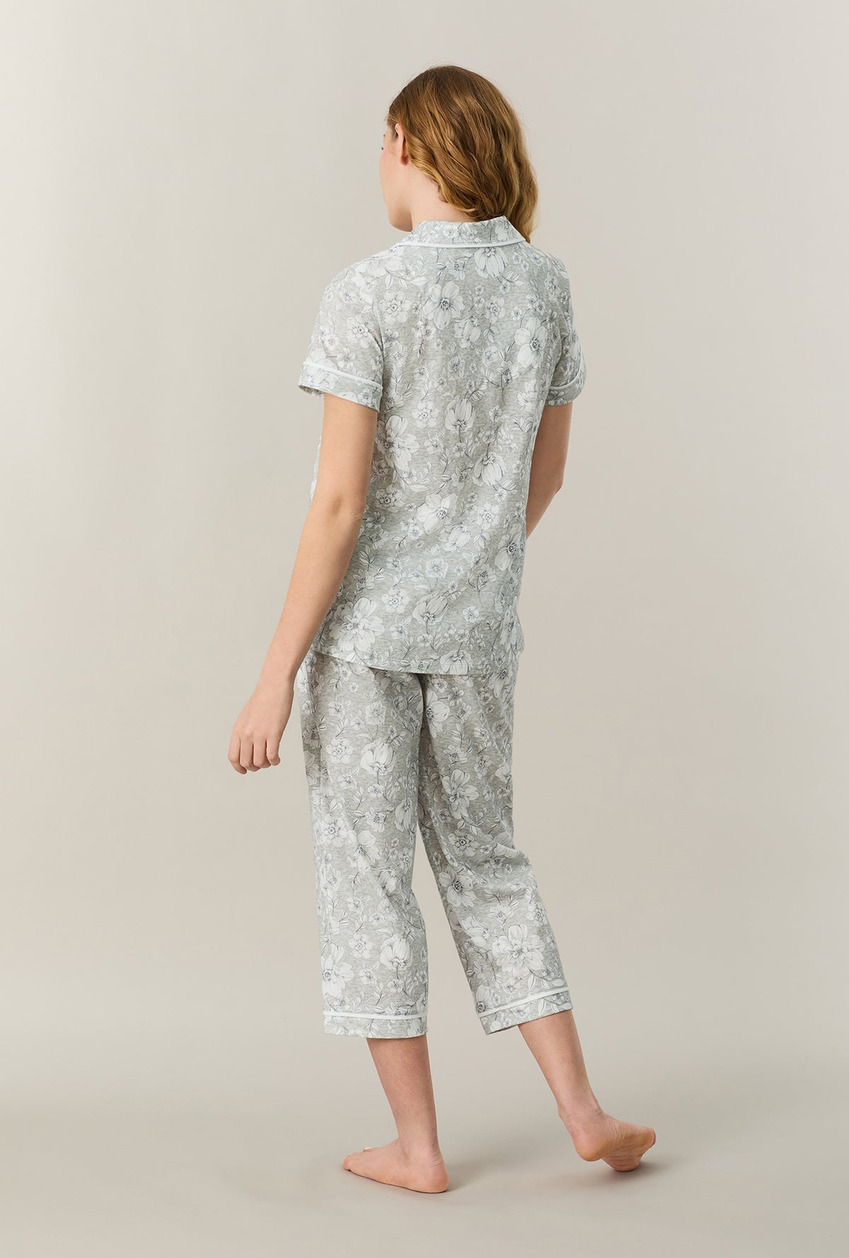 A lady wearing Grey Heather Floral Cotton Capri Pajama Set back view