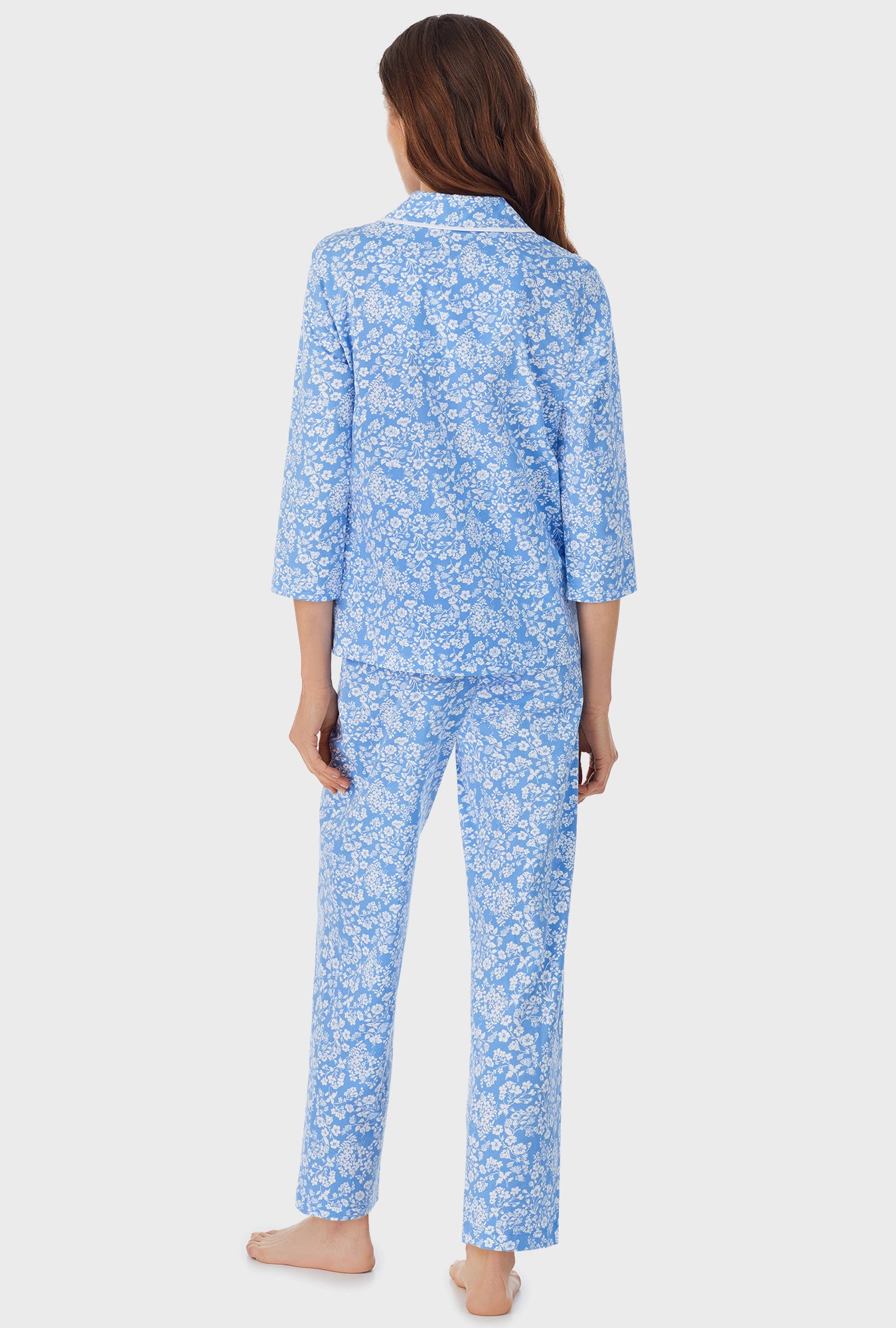 A lady wearing blue long pajama set with Cutout Floral  print