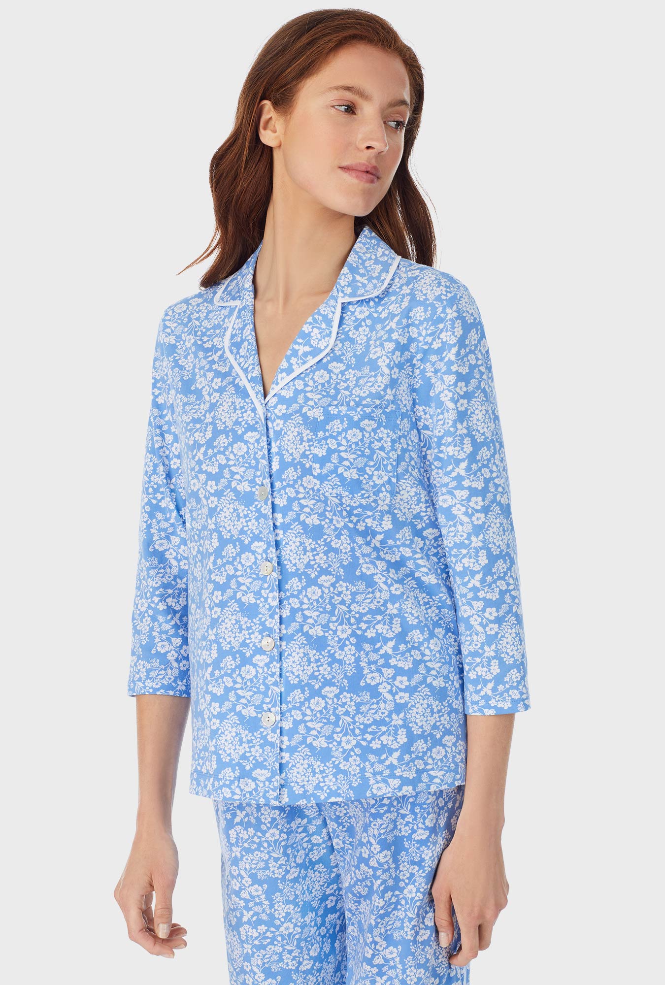 A lady wearing blue long pajama set with Cutout Floral  print