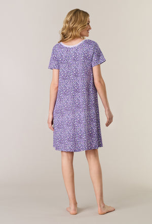 A lady wearing Lilac Garden Short Sleeve Cotton Interlock Short Nightgown back view