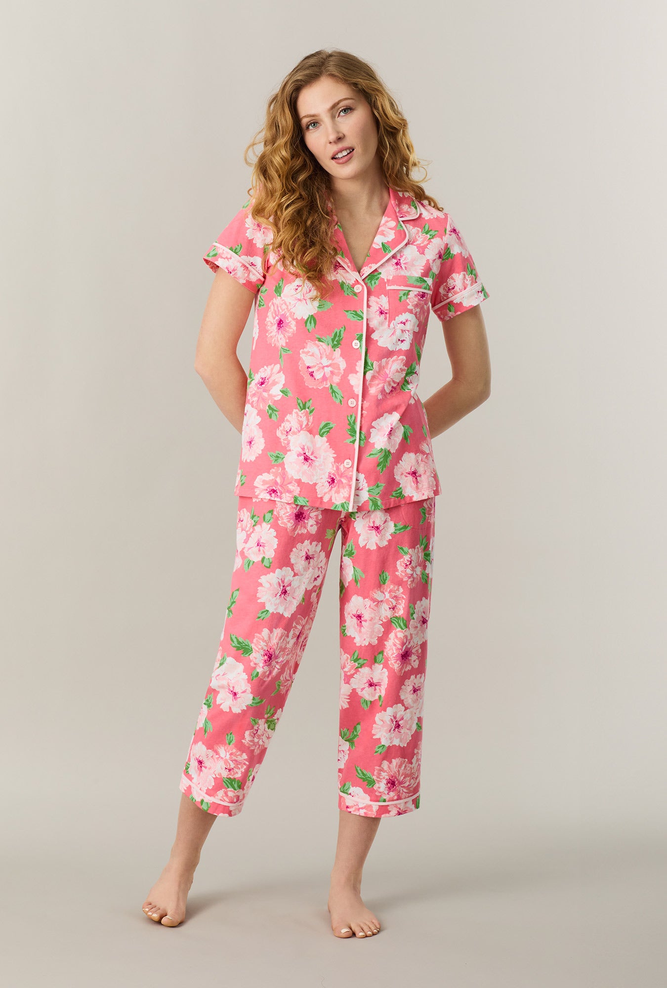A lady wearing Coral Blooms Cotton Capri Pajama Set