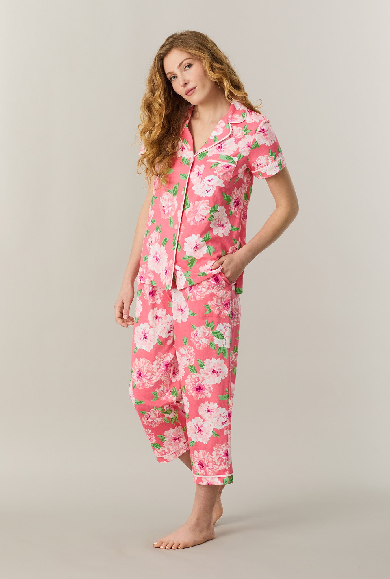 A lady wearing Coral Blooms Cotton Capri Pajama Set