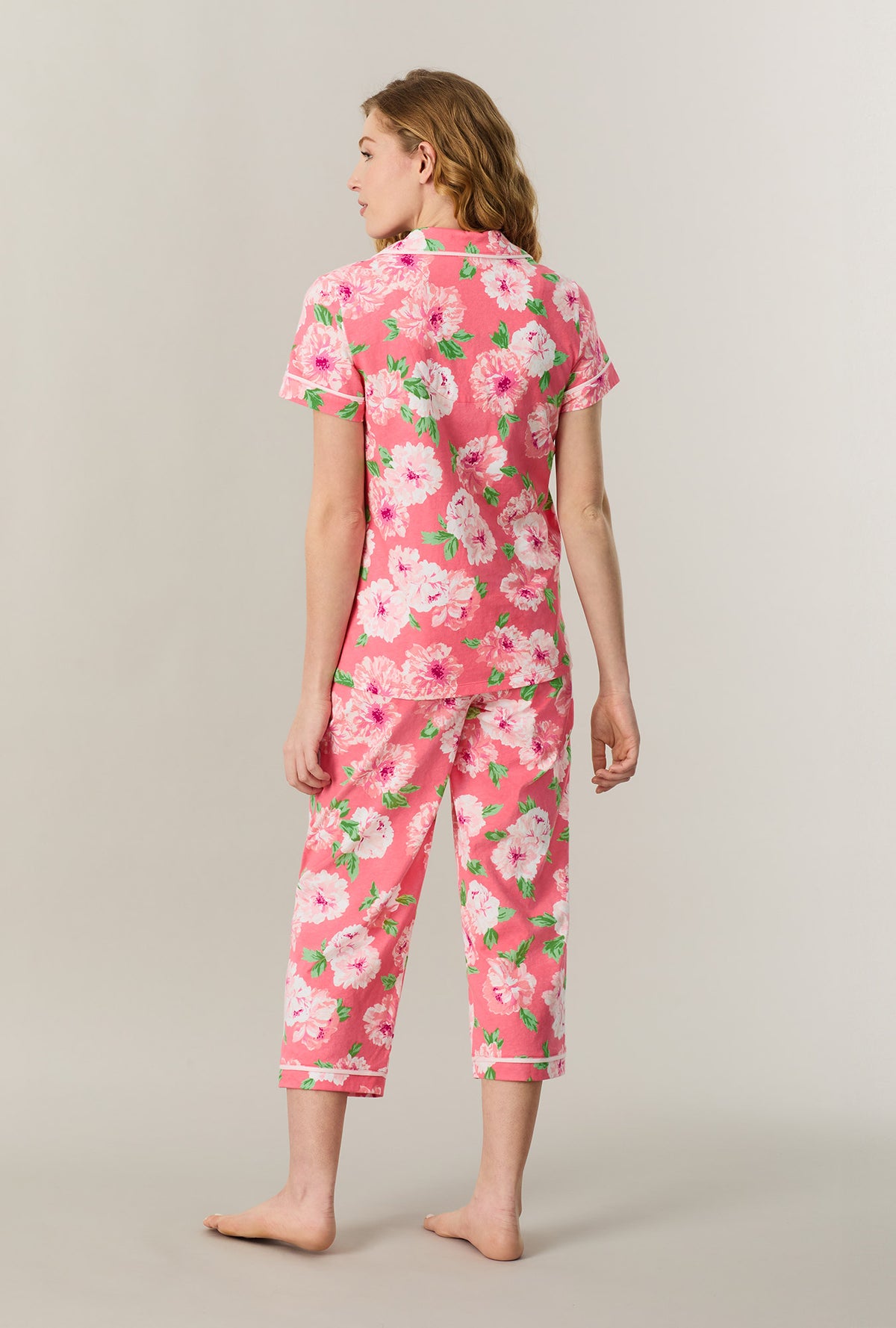 A lady wearing Coral Blooms Cotton Capri Pajama Set back view
