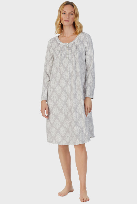 A lady wearing grey long sleeve fleece icy damask nightgown.