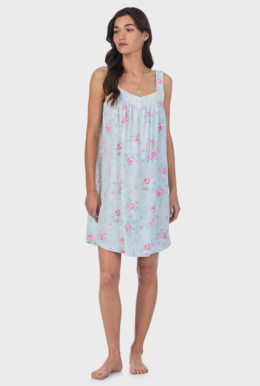 A lady wearing blue sleeveless Cotton Short Nightgown with French Garden print.