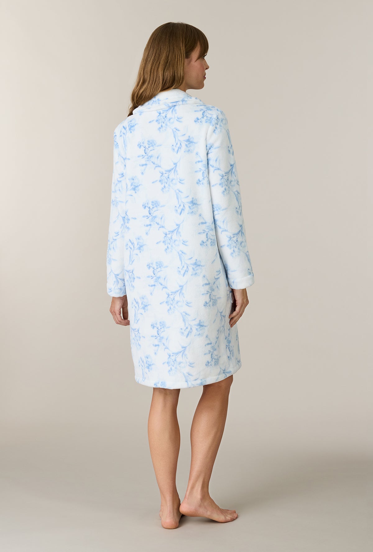 A lady wearing Winter Blue Floral Chenille Short Zip Robe back view