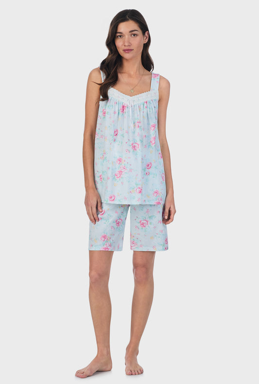 A lady wearing blue sleeveless Cotton Bermuda Pajama Set with French Garden print.