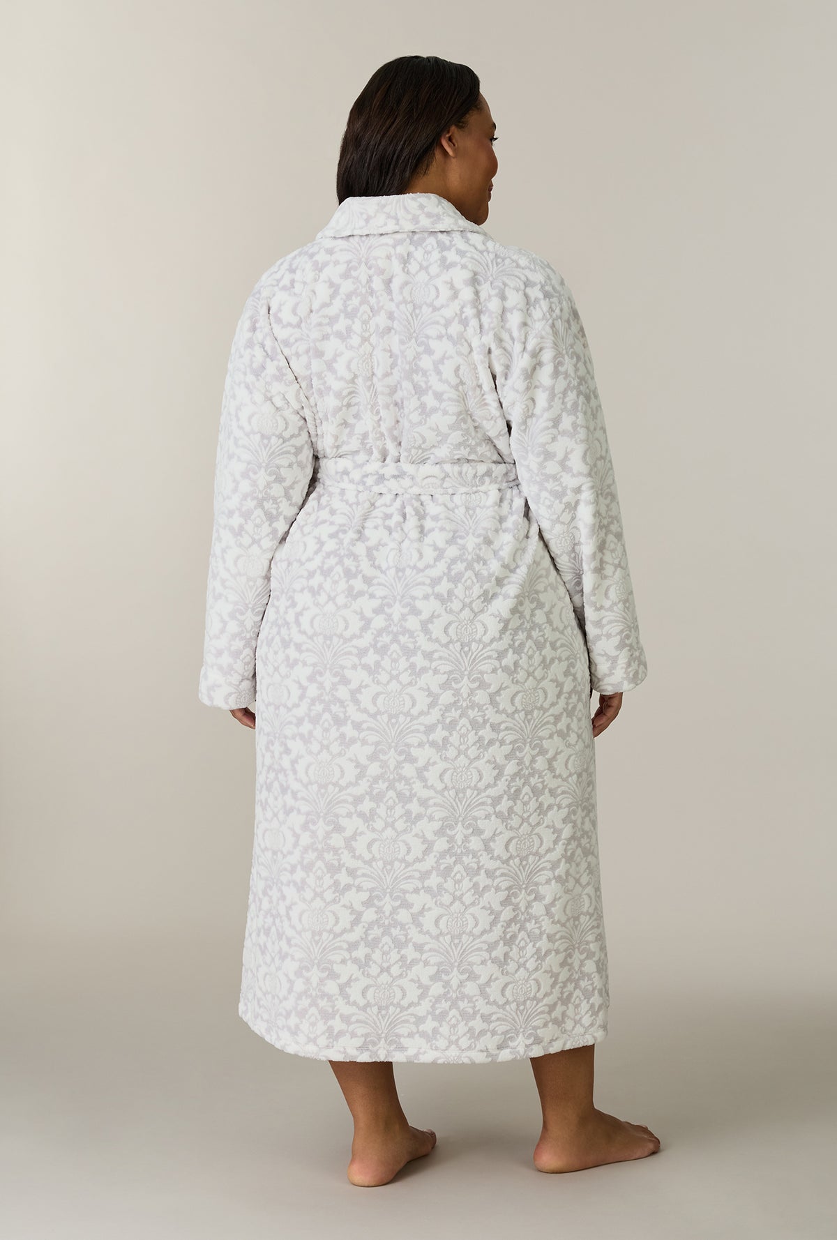 A lady wearing plus size Pearl Damask Wrap Two-Tone Velour Ballet Robe back view