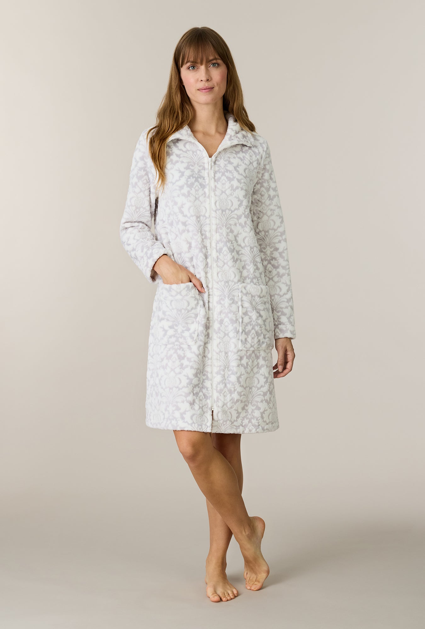 A lady wearing plus size Pearl Damask Two-Tone Velour Short Zip Robe