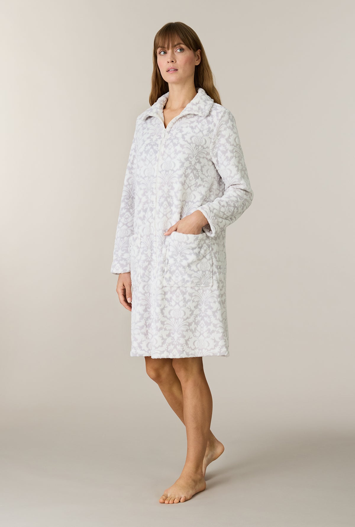 A lady wearing Pearl Damask Two-Tone Velour Short Zip Robe