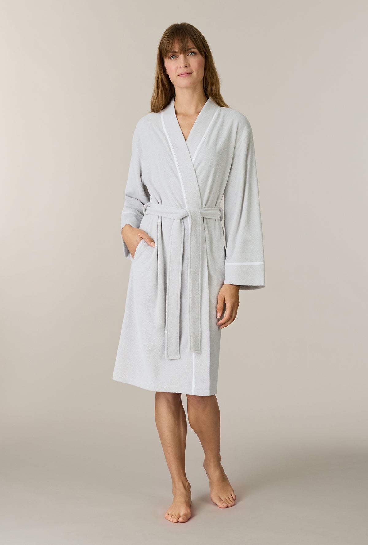 A lady wearing Lunar Rock Terry Wrap Waltz Robe