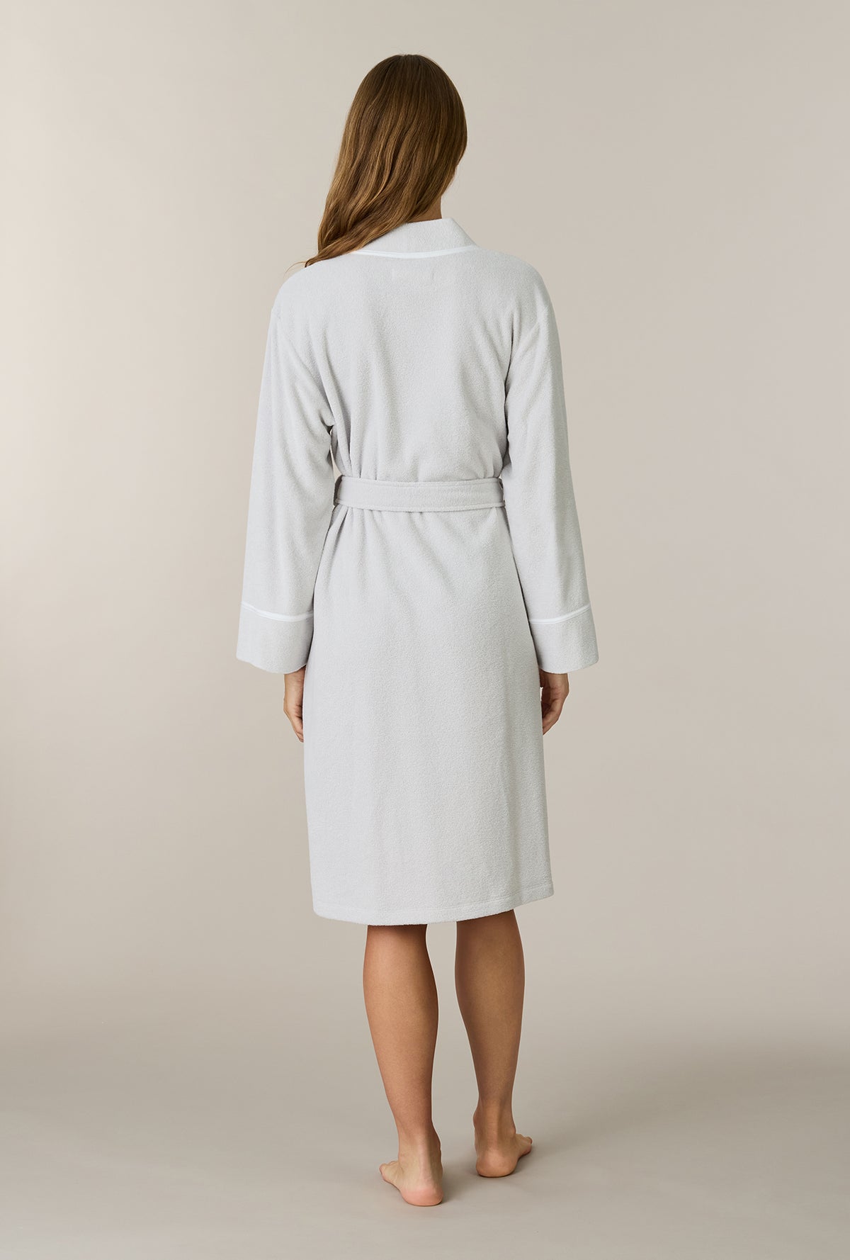 A lady wearing Lunar Rock Terry Wrap Waltz Robe back view