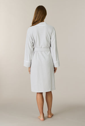 A lady wearing Lunar Rock Terry Wrap Waltz Robe back view