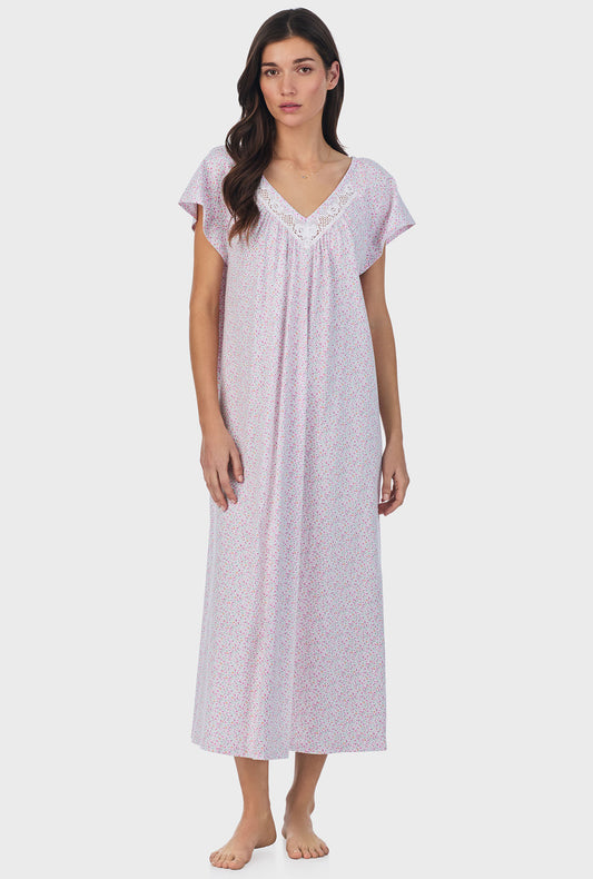 A lady wearing pink short sleeve cotton ballet nightgown with tulip field print.