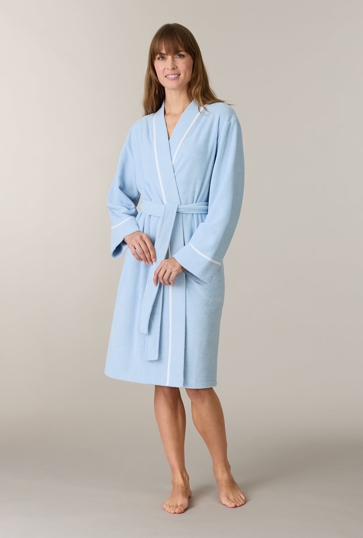 A lady wearing Cashmere Blue Terry Wrap Waltz Robe looking front