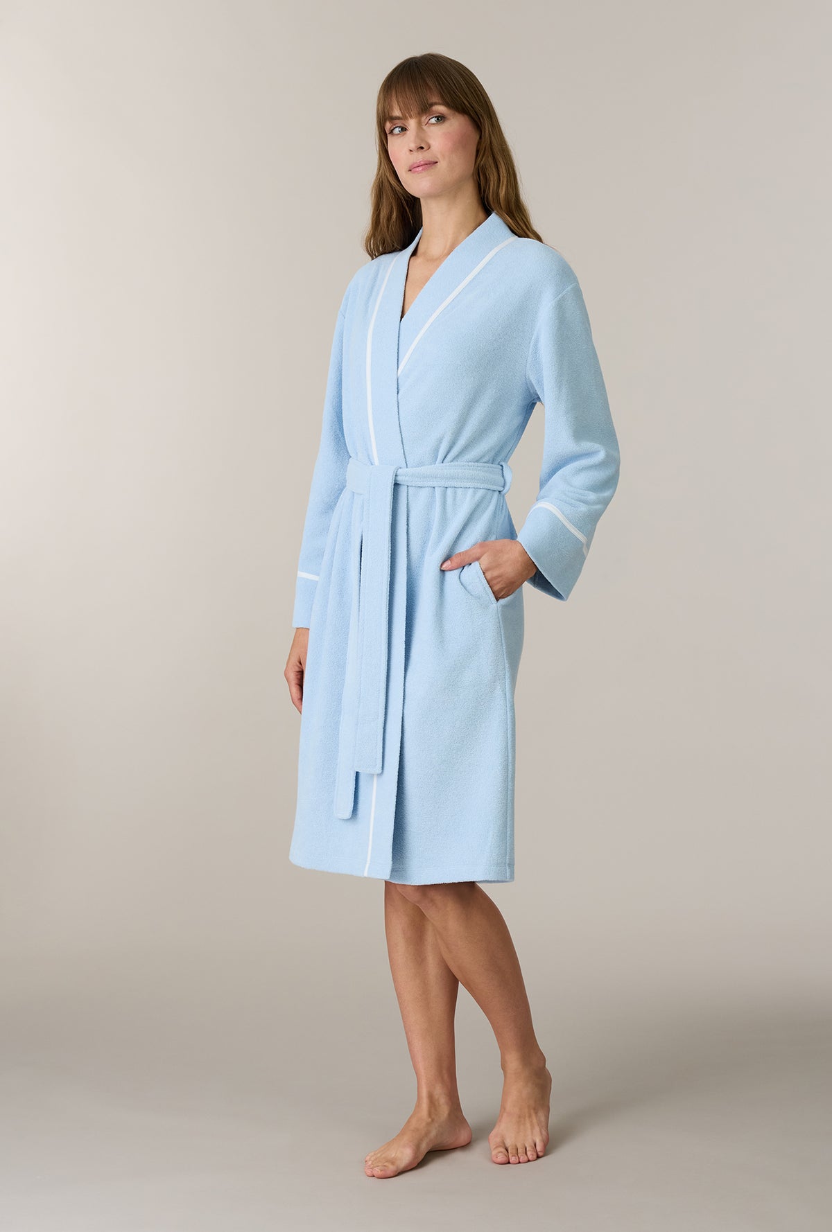 A lady wearing Cashmere Blue Terry Wrap Waltz Robe