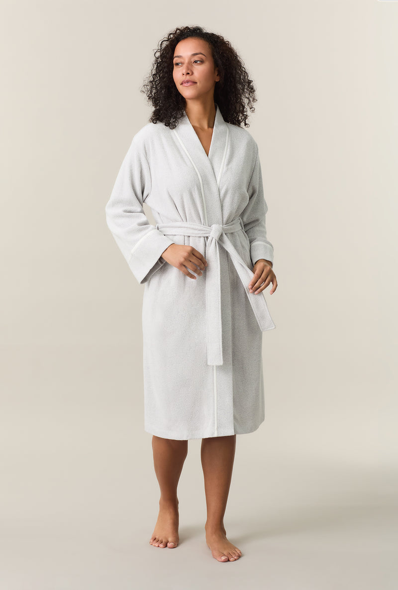 A lady wearing Lunar Rock Terry Wrap Waltz Robe