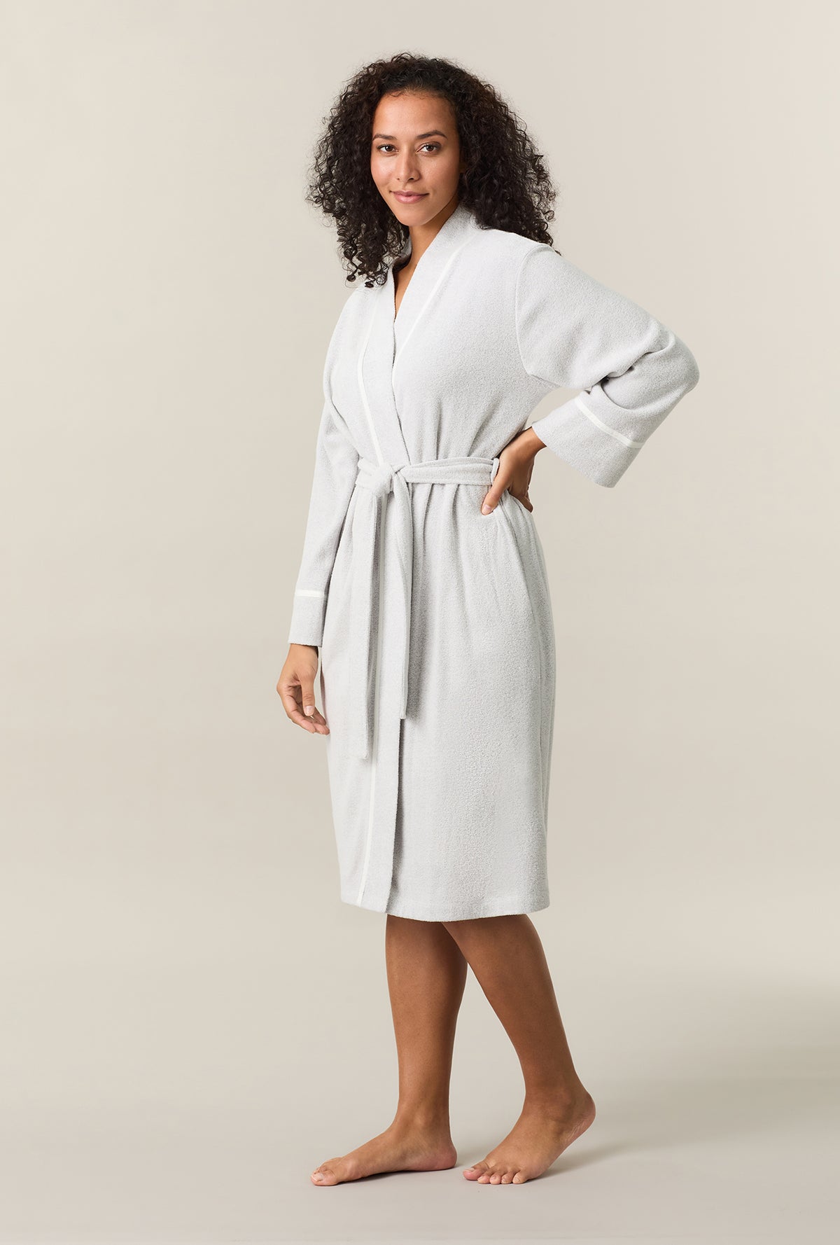 A lady wearing Lunar Rock Terry Wrap Waltz Robe