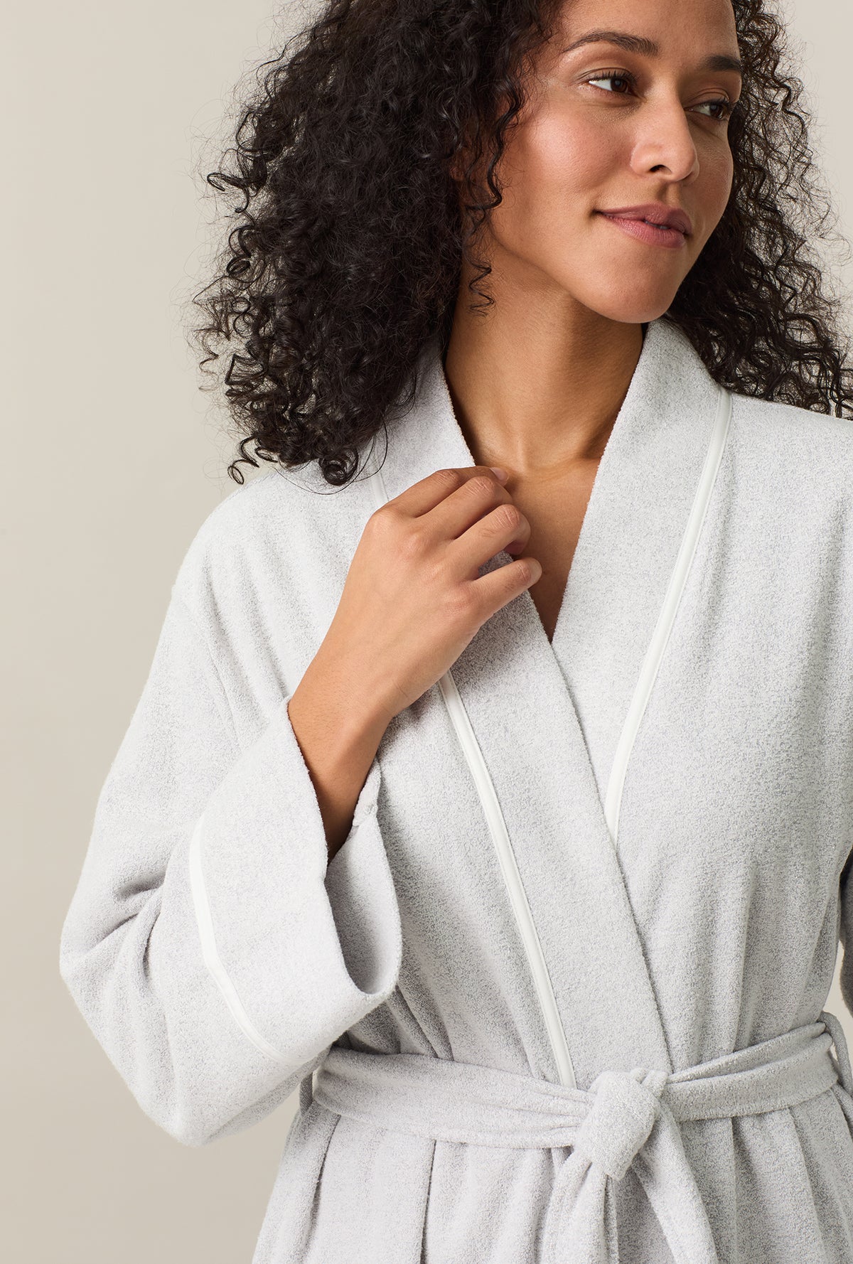 A lady wearing Lunar Rock Terry Wrap Waltz Robe