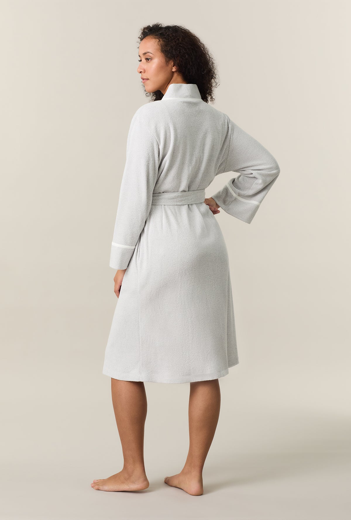 A lady wearing Lunar Rock Terry Wrap Waltz Robe