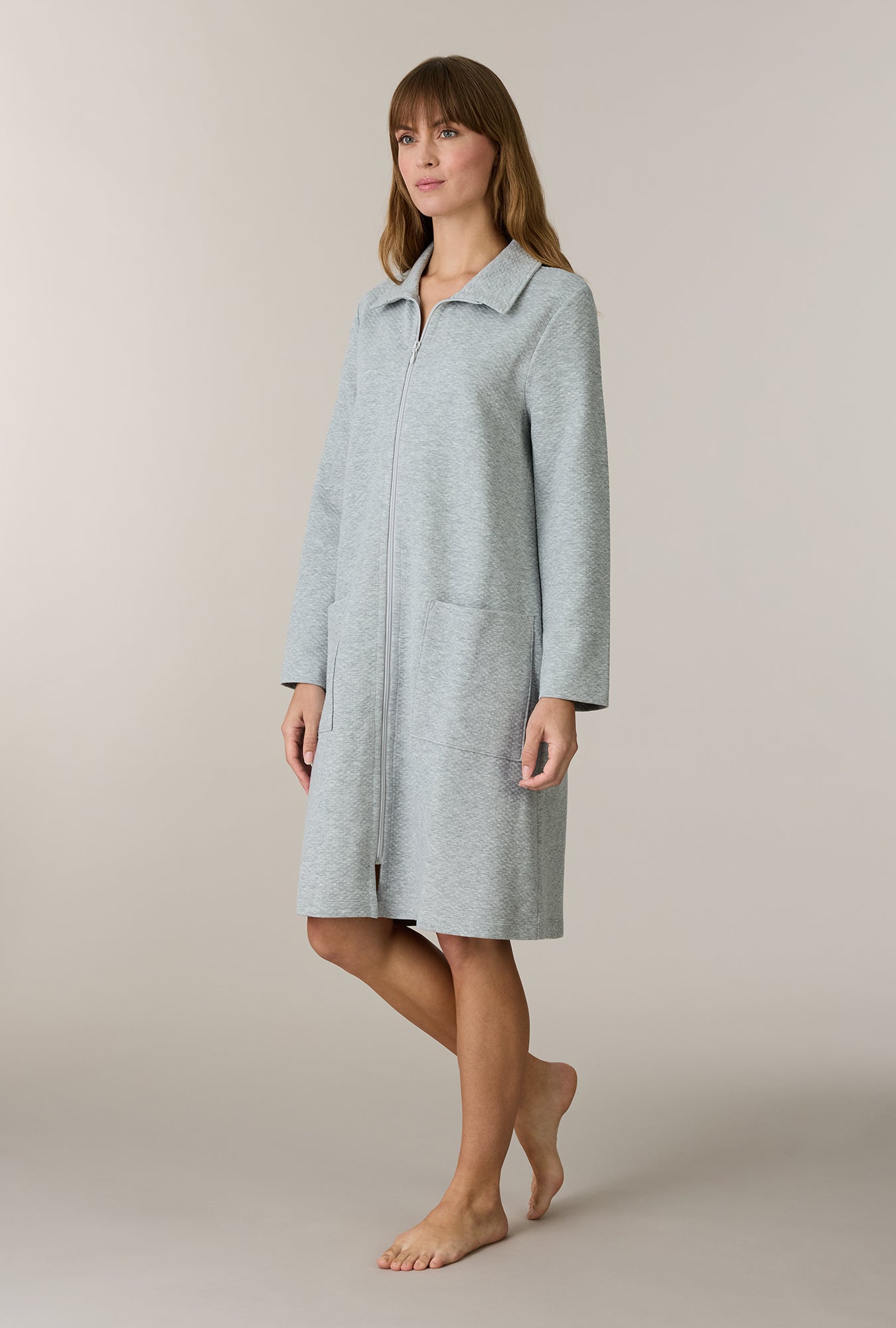 A lady wearing Grey Heather Cotton Diamond Quilted Zip Robe
