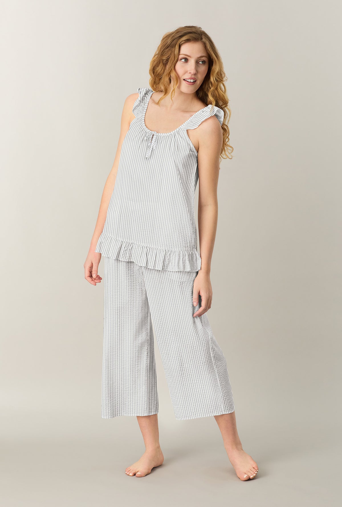 A lady wearing Grey Stripe Seersucker Culotte Pajama Set looking side