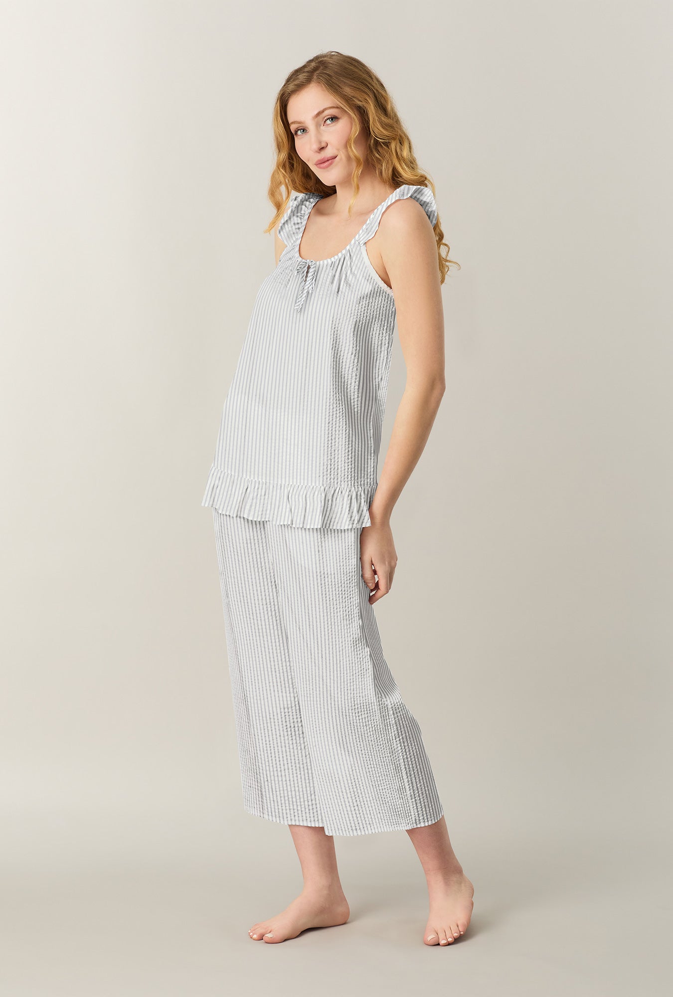 A lady wearing Grey Stripe Seersucker Culotte Pajama Set looking side