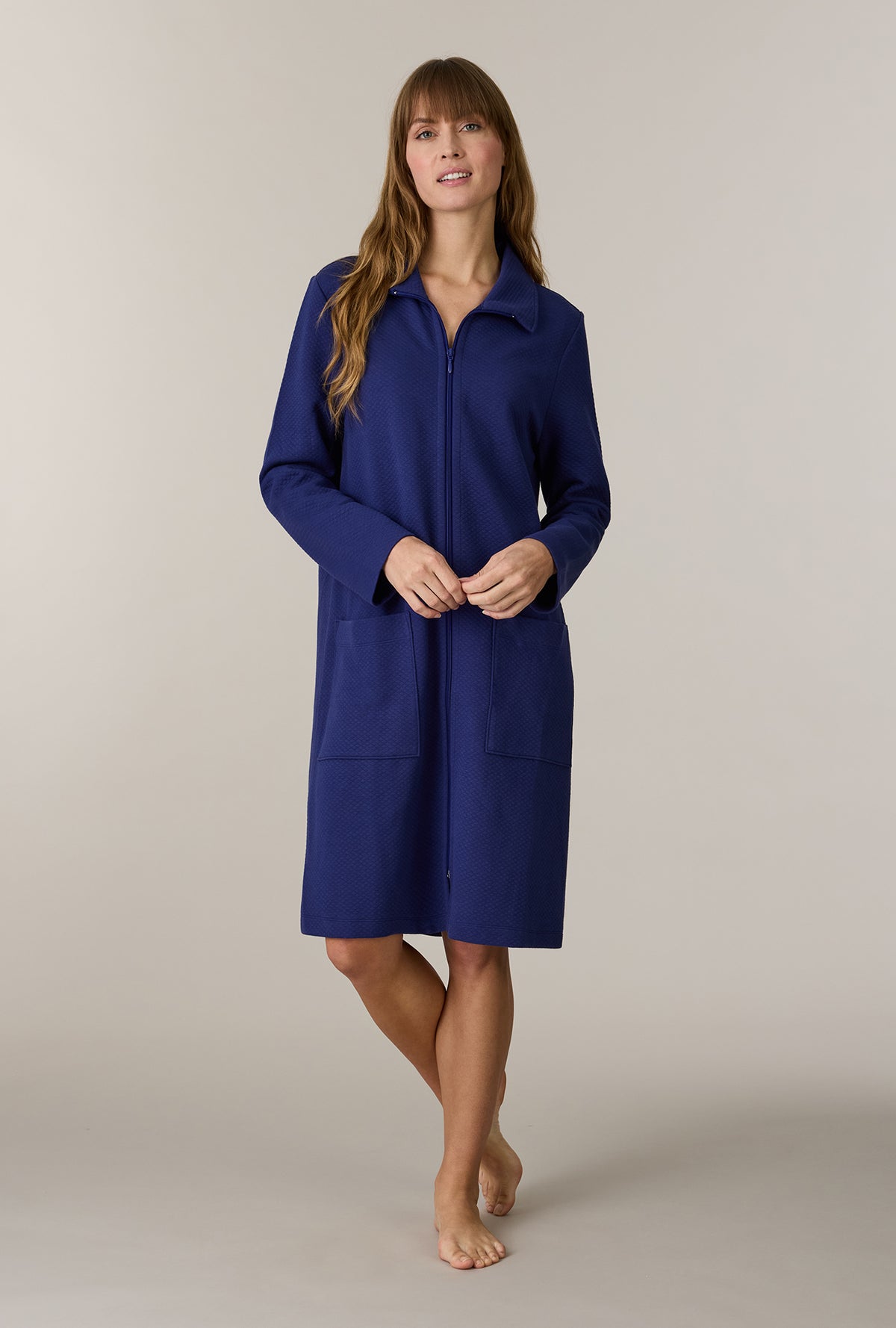 A lady wearing Midnight Navy Cotton Diamond Quilted Zip Robe looking front