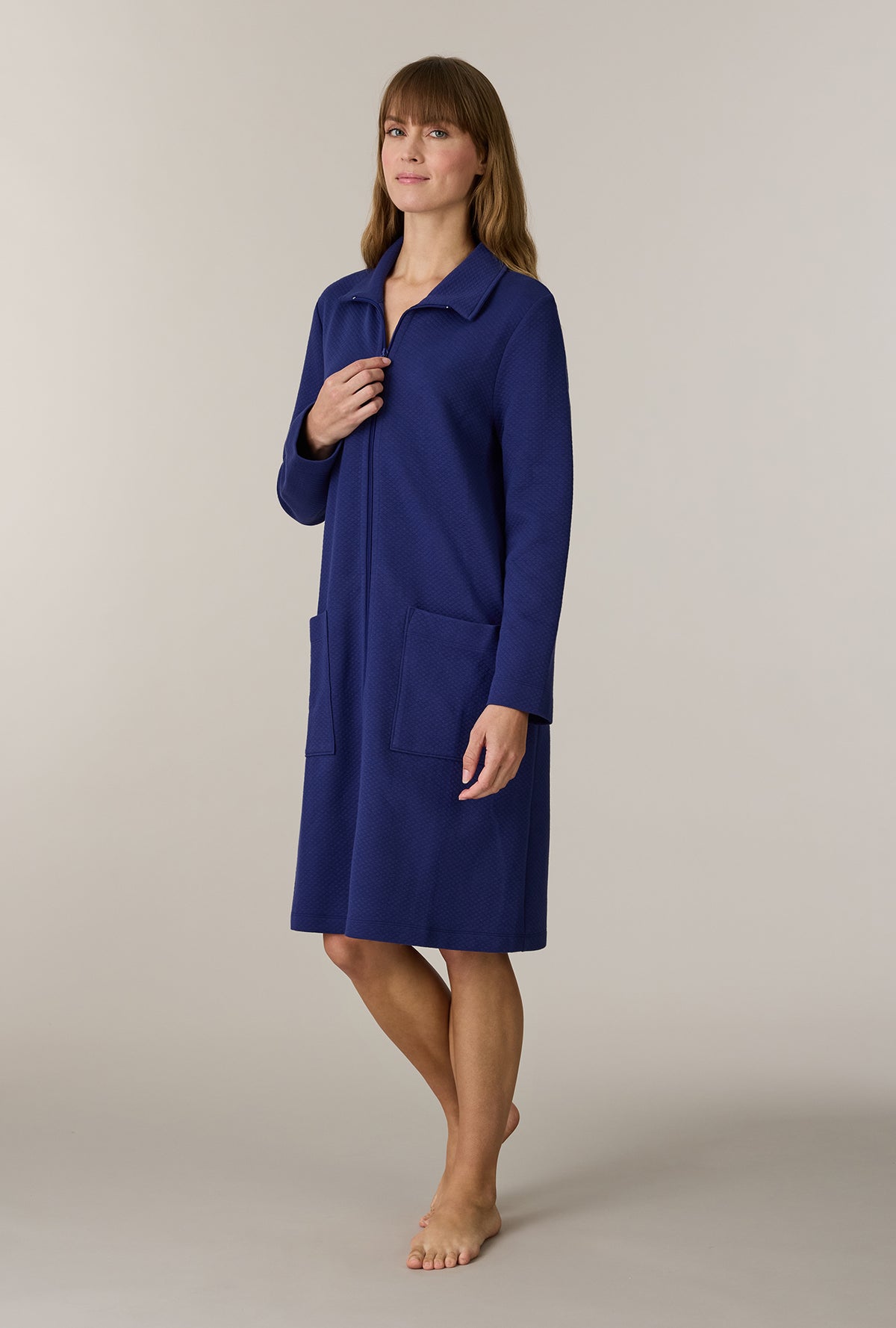 A lady wearing Midnight Navy Cotton Diamond Quilted Zip Robe