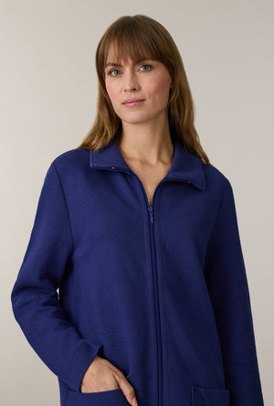 A lady wearing Midnight Navy Cotton Diamond Quilted Zip Robe closer look