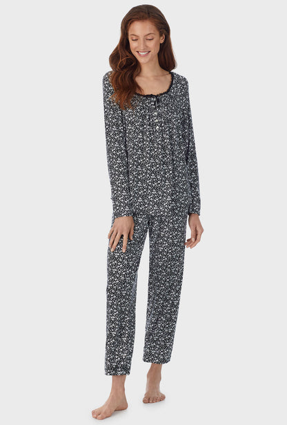 A lady wearing black long pajama set with midnight disty  print