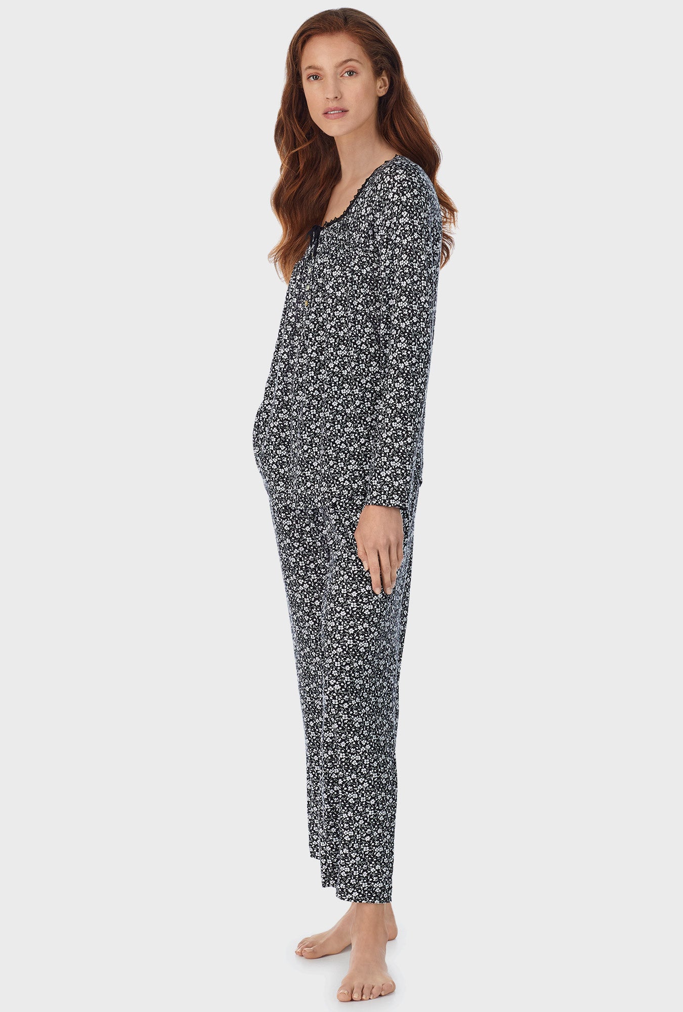 A lady wearing black long pajama set with midnight disty  print