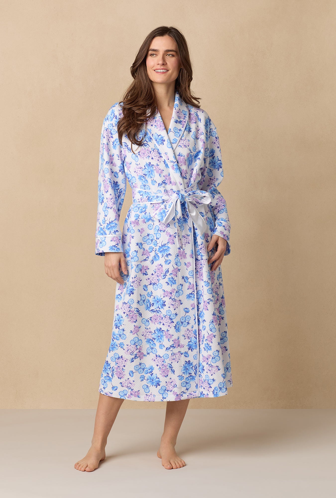 Purple Hydrangea; Missy Model is wearing Size Small. She is 5'10", Bust 32", Waist 24", Hips 35"@A lady wearing Purple Hydrangea 
long sleeve diamond quilted wrap robe.