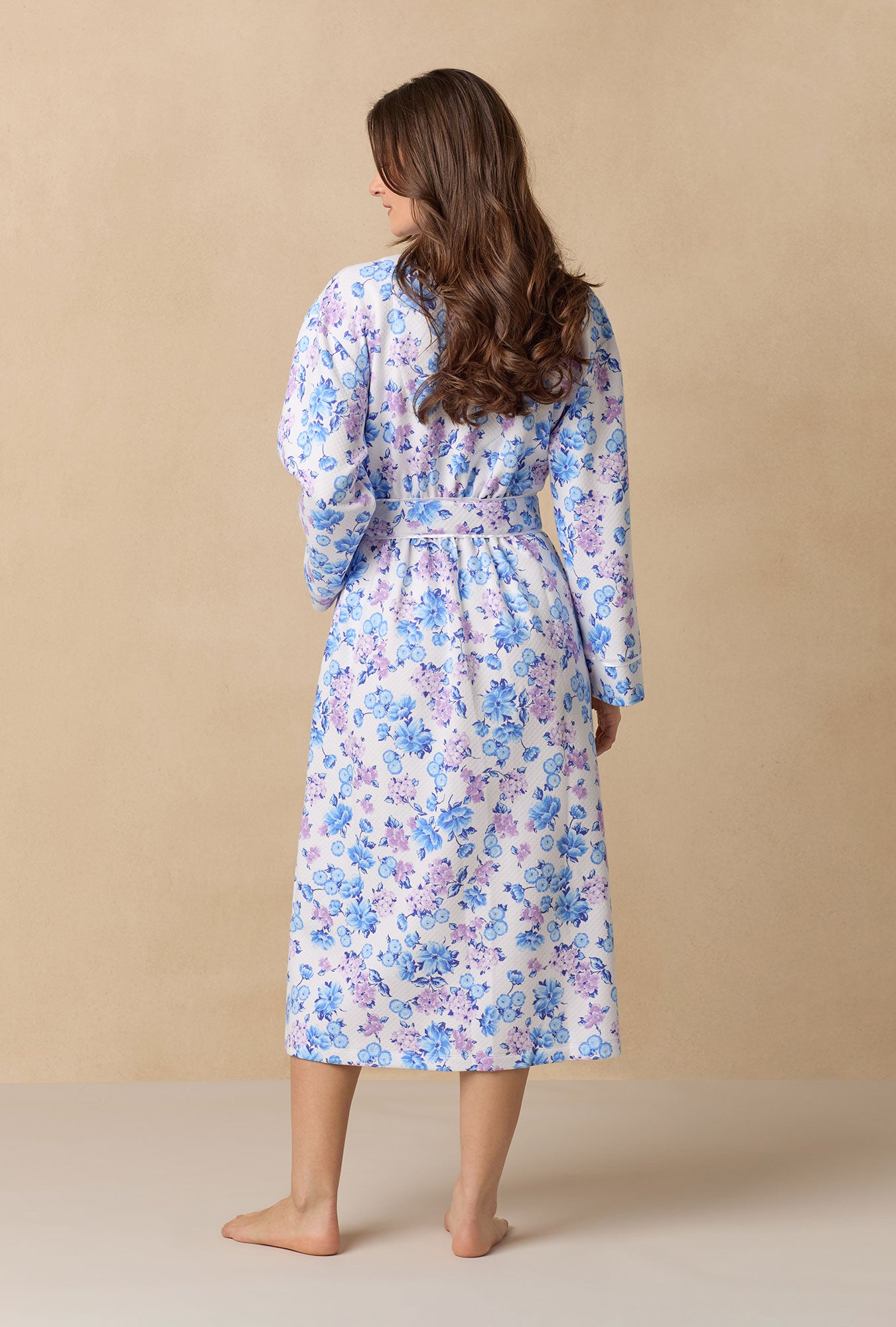A lady wearing Purple Hydrangea 
long sleeve diamond quilted wrap robe.