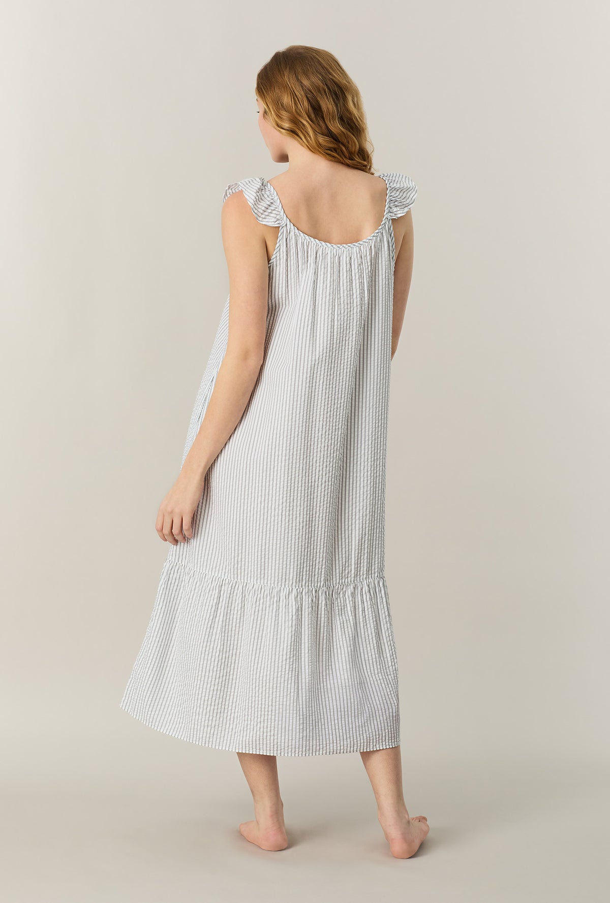 A lady wearing Grey Stripe Seersucker Midi Chemise back view