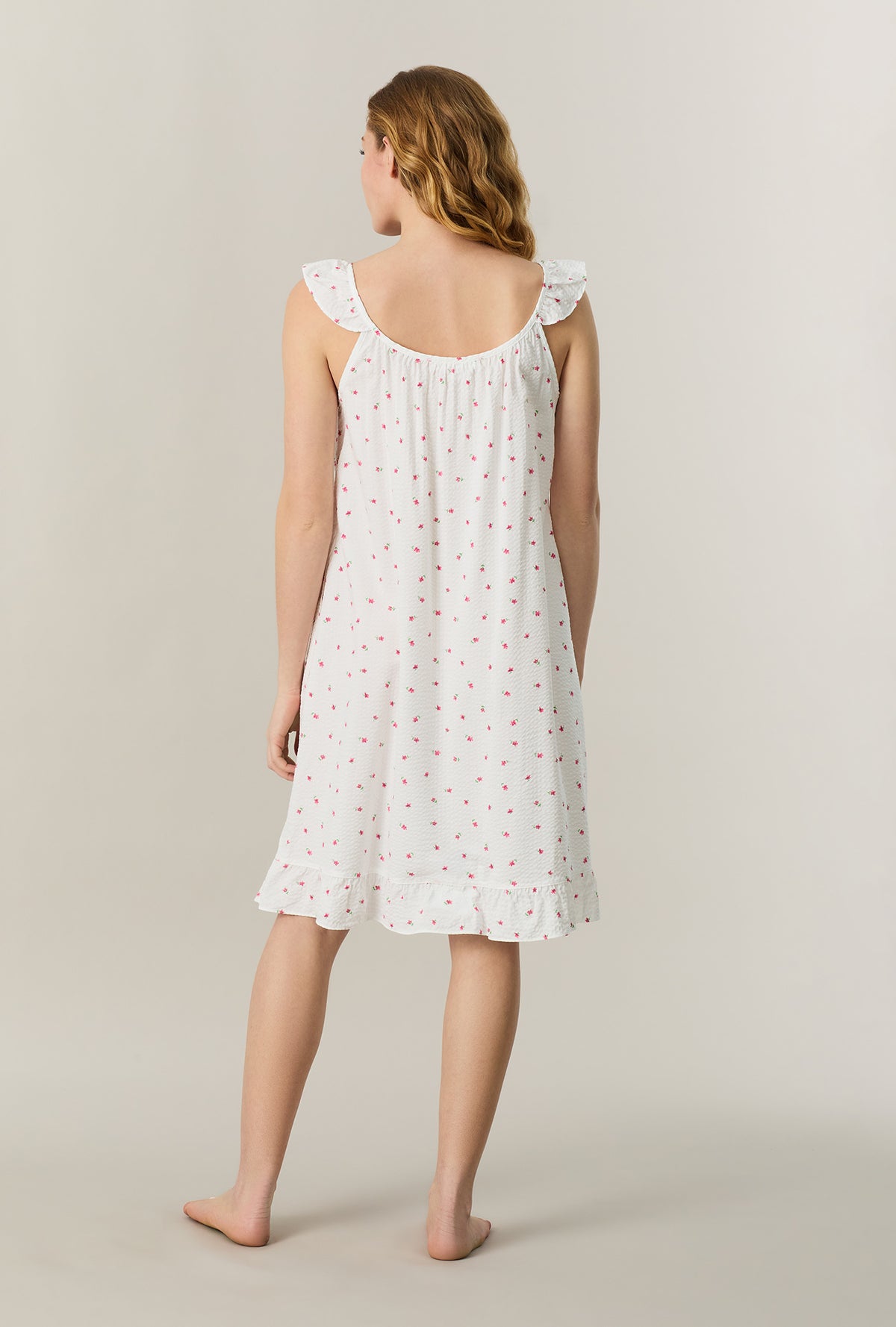 A lady wearing Fresh Petals Seersucker Short Chemise back view