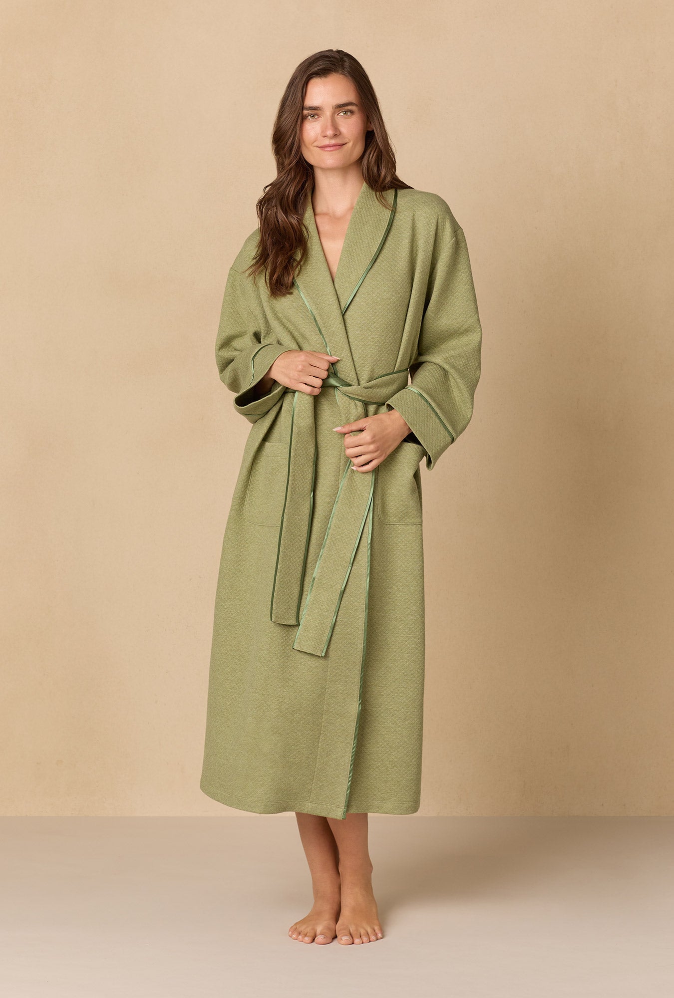 A lady wearing Heather Sage Diamond Quilted Wrap Robe
