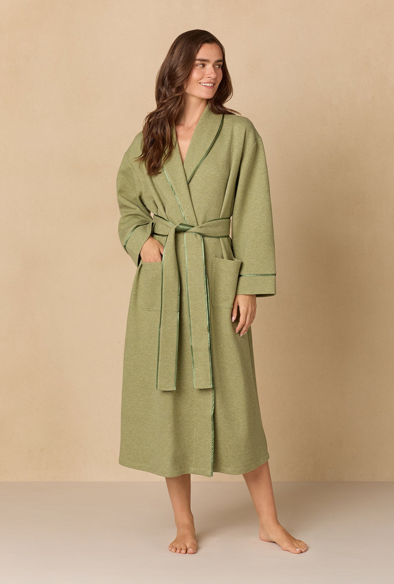 A lady wearing Heather Sage Diamond Quilted Wrap Robe