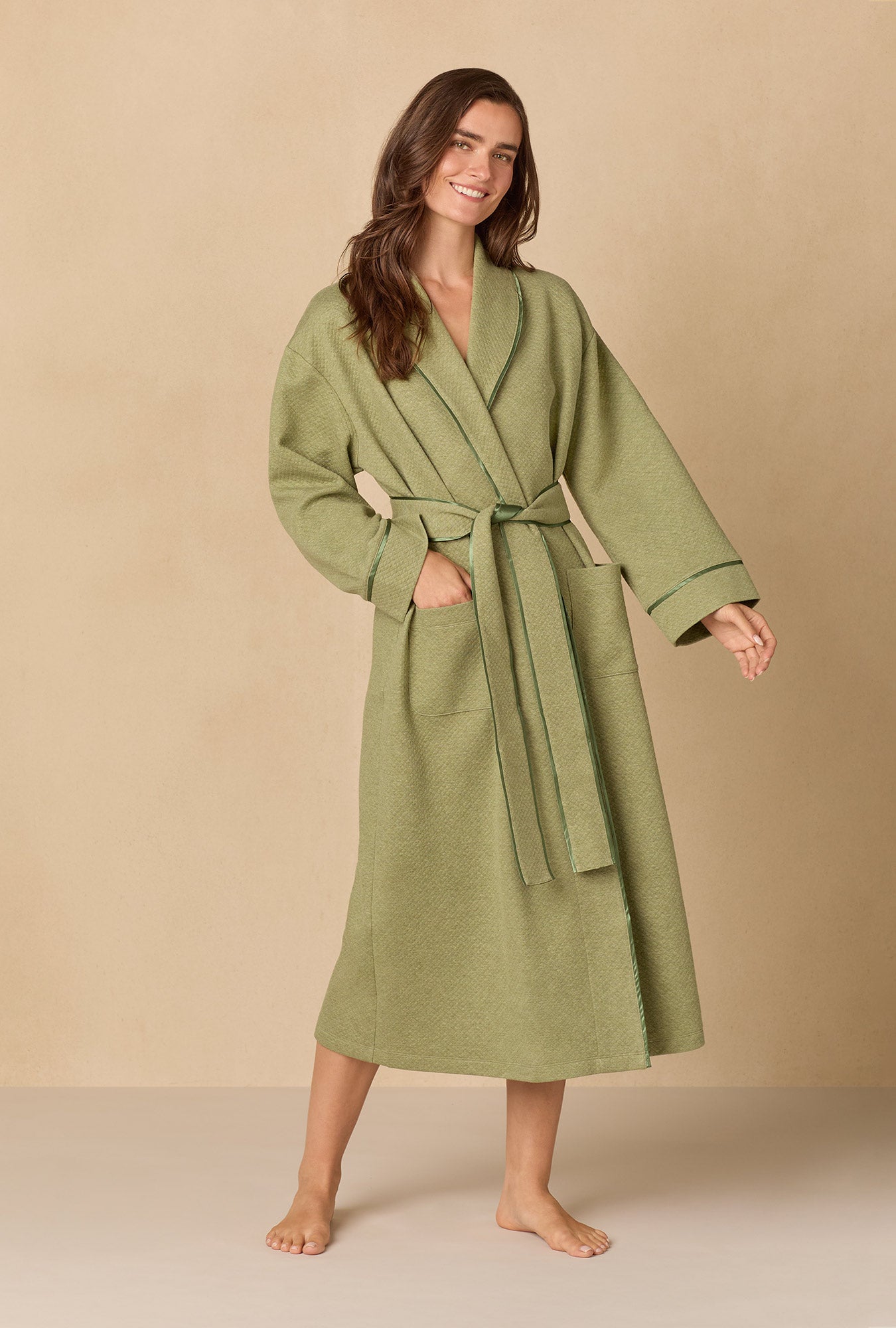 A lady wearing Heather Sage Diamond Quilted Wrap Robe