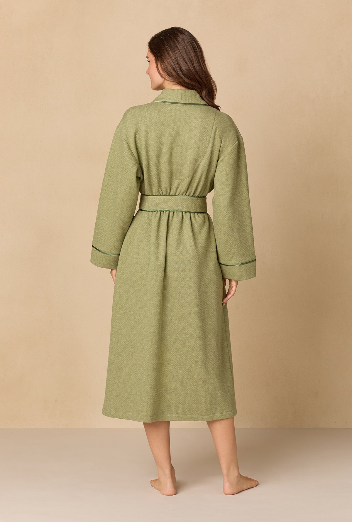 A lady wearing Heather Sage Diamond Quilted Wrap Robe