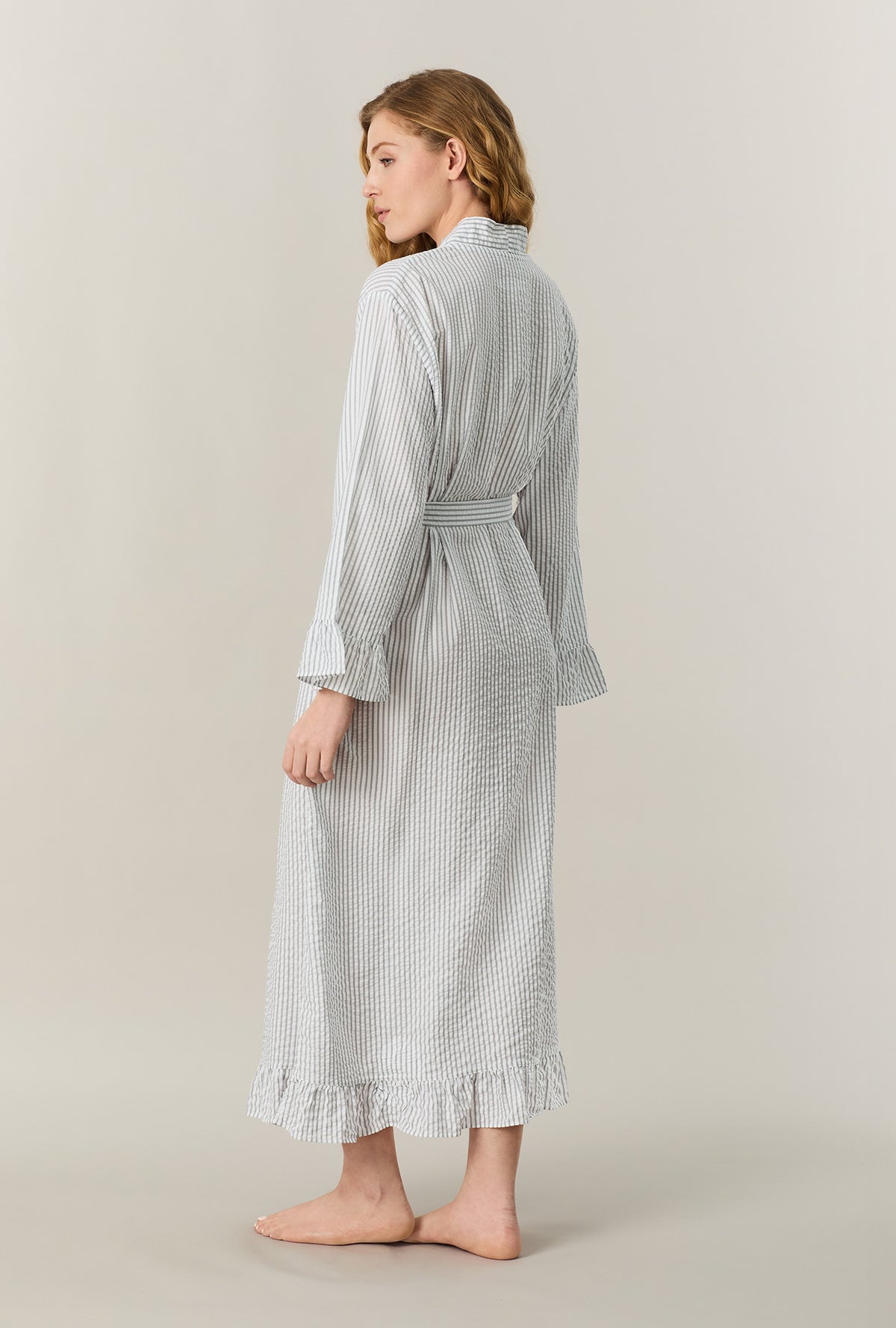 A lady wearing Grey Stripe Seersucker Long Robe back view
