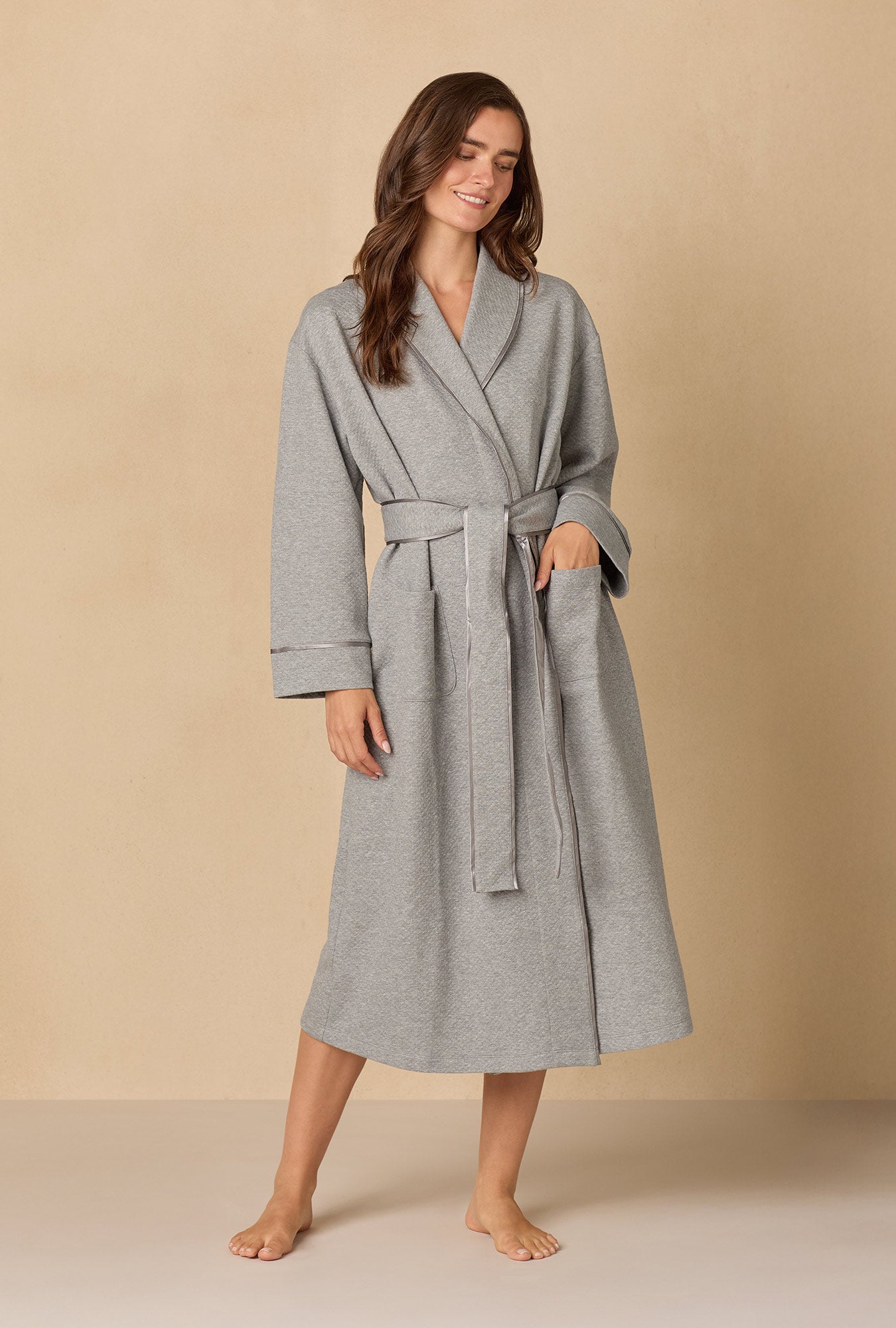 A lady wearing Heather Grey Diamond Quilted Wrap Robe