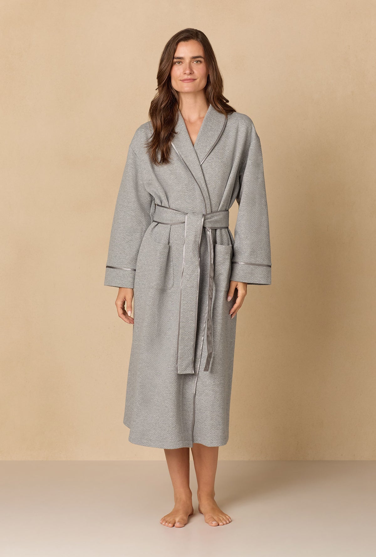 A lady wearing Heather Grey Diamond Quilted Wrap Robe