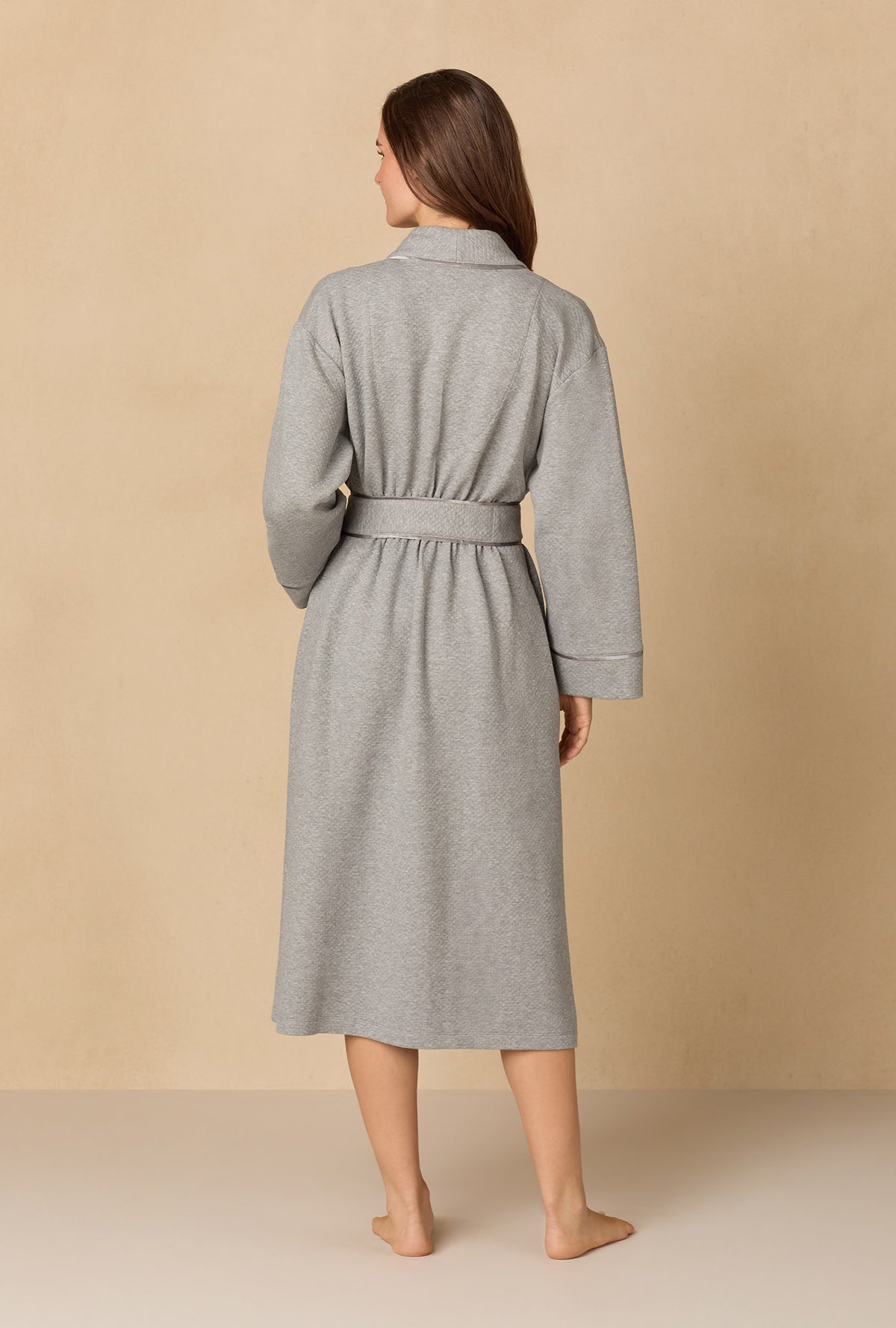 A lady wearing Heather Grey Diamond Quilted Wrap Robe