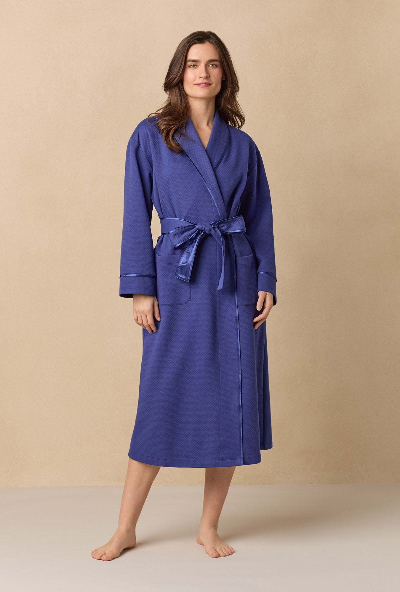 A lady wearing Navy Diamond Quilted Wrap Robe