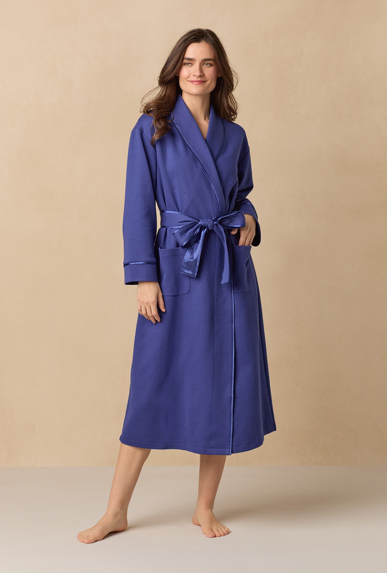 A lady wearing Navy Diamond Quilted Wrap Robe